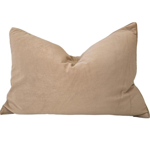 Beige pillow on a light gray sofa
