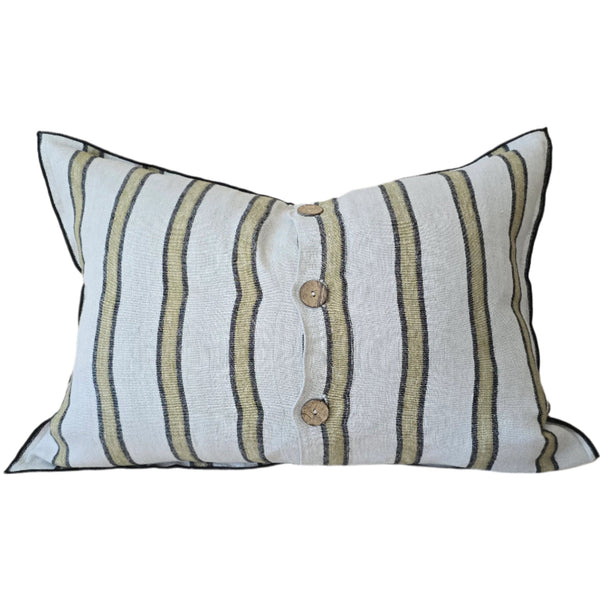 Striped pillow with button details on a neutral background