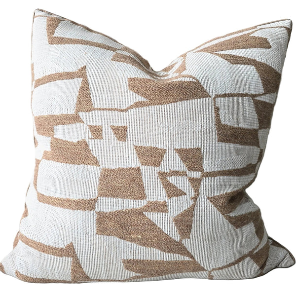 Decorative pillow with geometric pattern on a couch