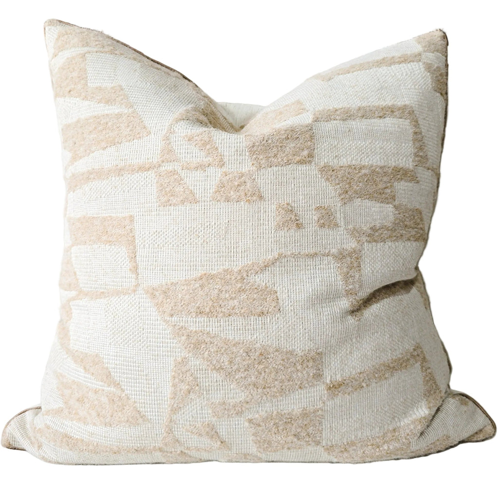 Decorative pillow with a geometric pattern on a couch