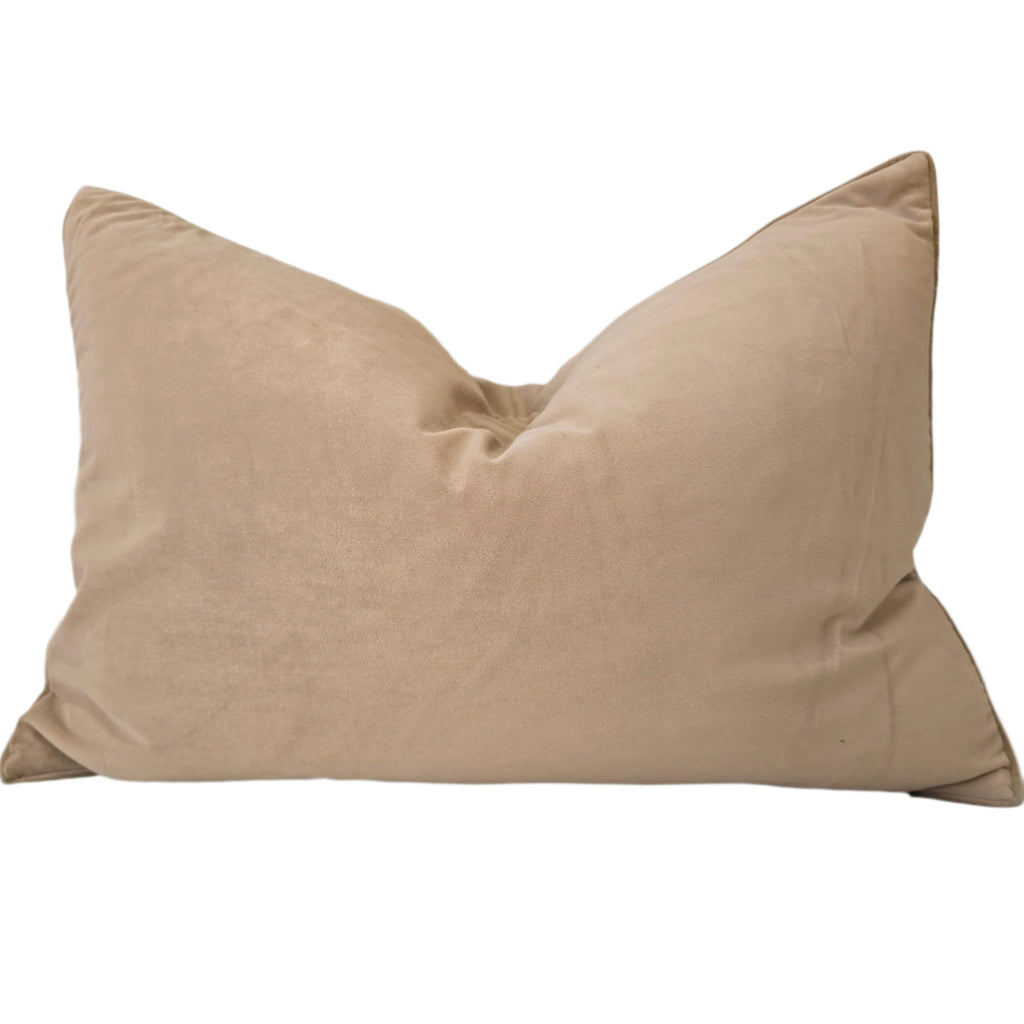 Beige pillow on a light gray sofa