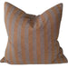 Striped pillow on a sofa with a neutral color palette