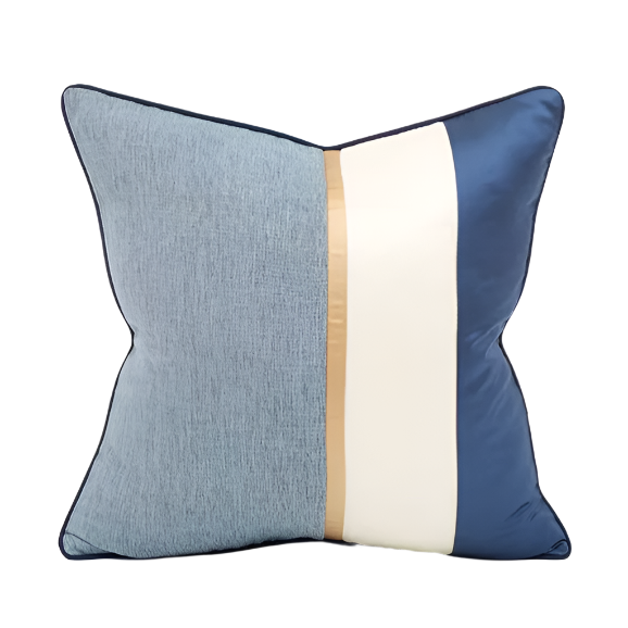Decorative pillow with blue, beige, and white color block design on a white background