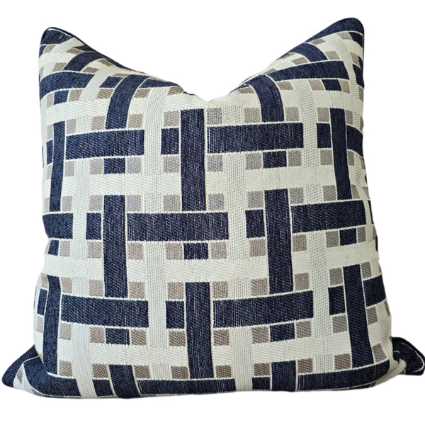Decorative pillow with geometric pattern on a neutral background