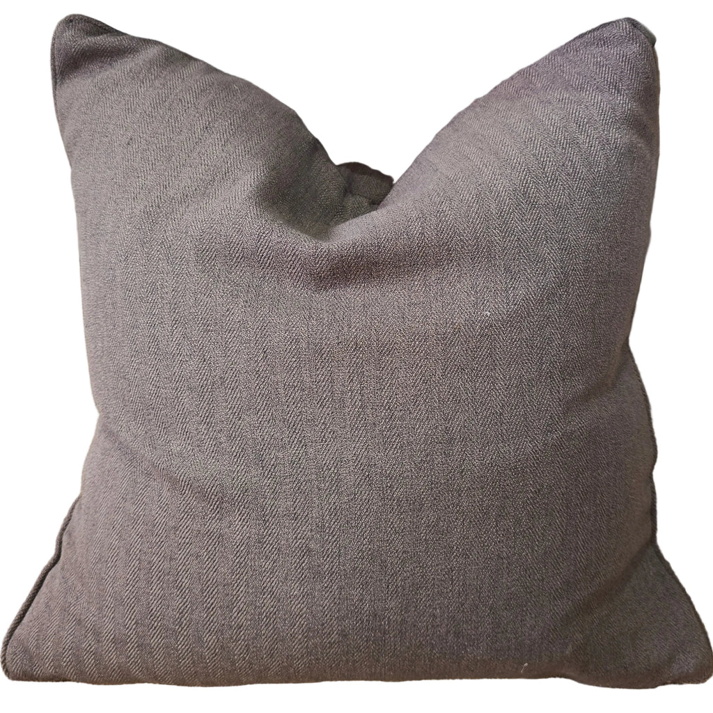 Gray pillow on a textured surface