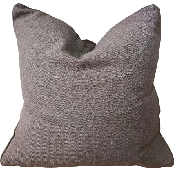 Gray pillow on a textured surface