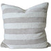 Striped pillow on a sofa with a neutral background