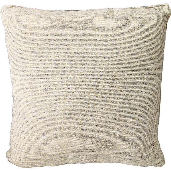 Outdoor Textured beige pillow on a sofa with a decorative lamp and rug in the background