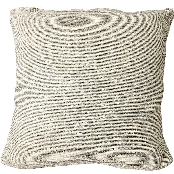 Outdoor Textured pillow on a sofa with a blurred background