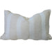 Beige pillow with white stripes on a beige sofa