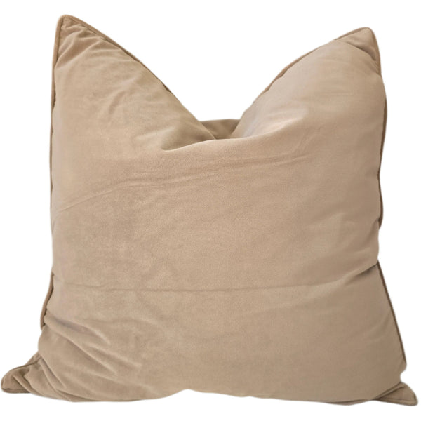 Beige pillow on a light-colored sofa