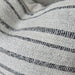 Close-up of textured fabric with black and gray stripes
